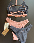 The Arya Bikini Top by Jaze shown from the back comes with thin, pink stripes and can be combined with our midnight or sunrise bikini bottom.