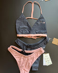 The Arya Bikini Top by Jaze shown from the front comes with thin, pink stripes and is combined with our midnight or sunrise bikini bottom. Mix & Match.