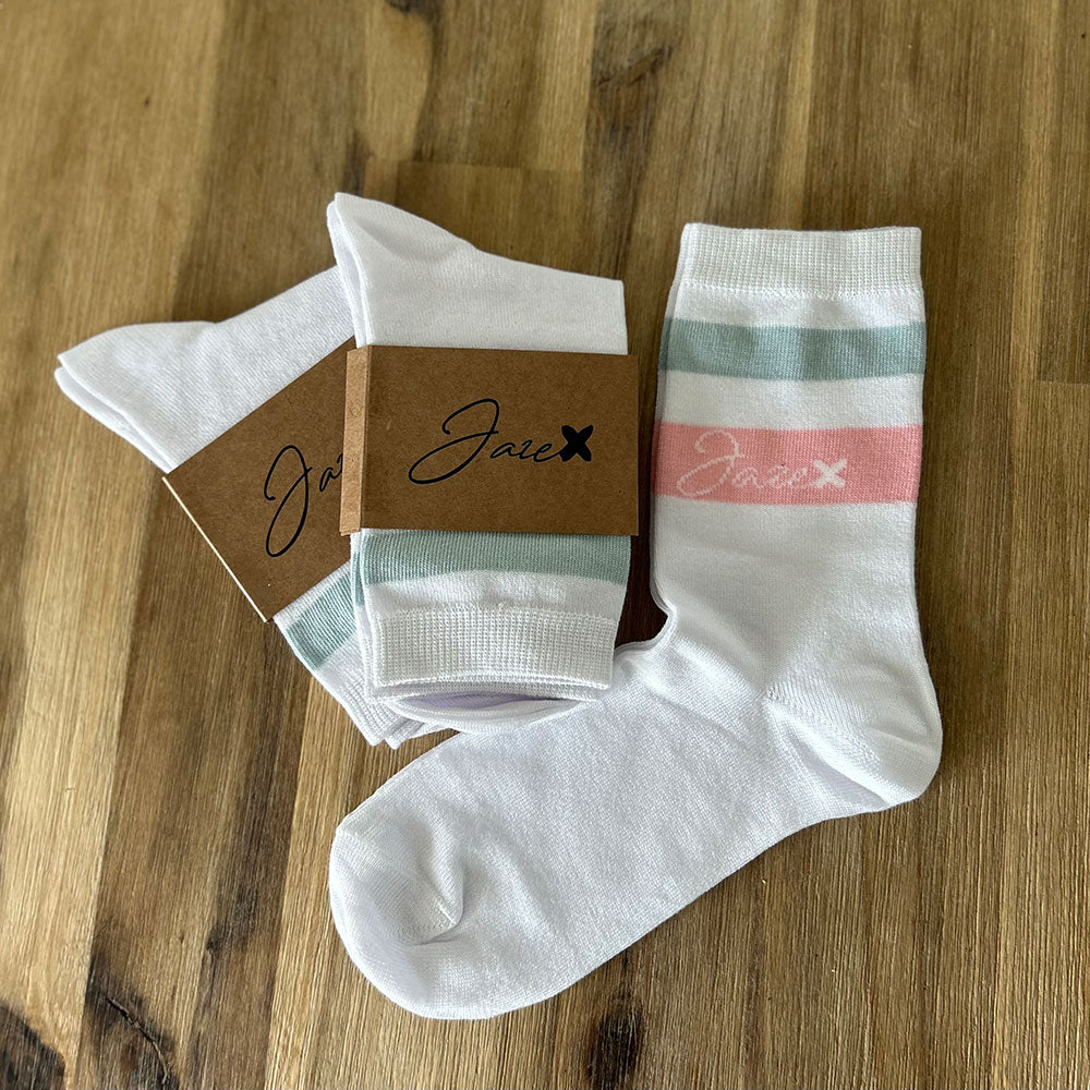 Bamboo summer socks in white with one mint and one rosy stripe above the ankle.