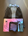 Equipment Mesh Baglying on a black surface shown from the front, showing the generous size and numerous pockets.