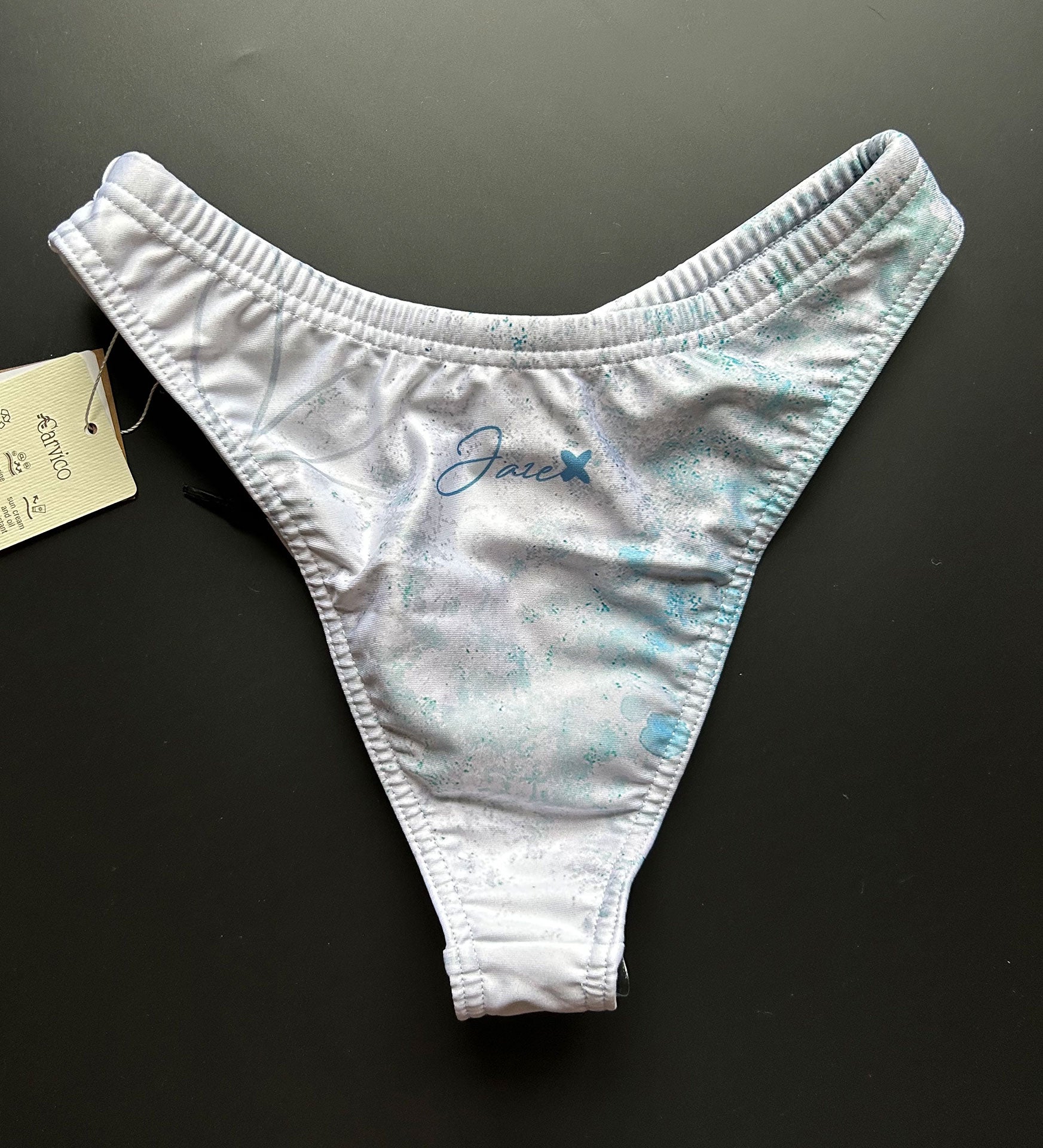 Our Flower of life – Bikini bottom shown from the back on a black surface for more details.