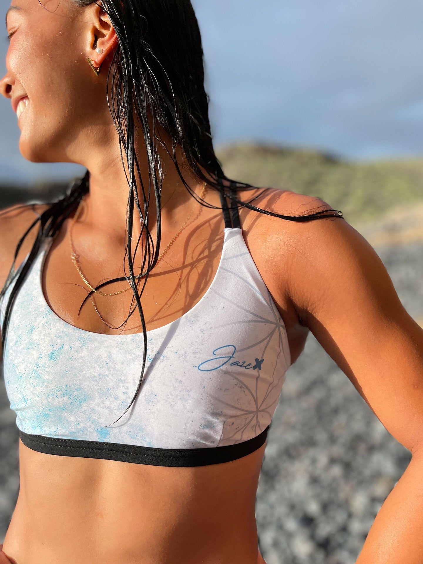 Female model wearing the Flower of life – Bikini top showing the details of the hand drawn pattern.