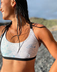 Female model wearing the Flower of life – Bikini top showing the details of the hand drawn pattern.