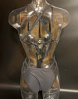 Back view of the Hailey One-Piece Swimsuit on a mannequin, featuring the open-back cut and secure fit.