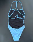Our INTO-THE-BLUE One-Piece-Swimsuit shown from the back, lying on black background showing the open back and the knotted straps.
