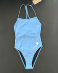 Our INTO-THE-BLUE One-Piece-Swimsuit shown from the front, lying on black background for more details.