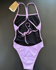 Our Lavender One-Piece-Swimsuit lying on a black surface shown from the back, showing the open back and adjustable straps.