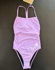 Our Lavender One-Piece-Swimsuit lying on a black surface shown from the front.