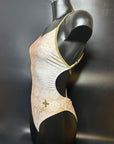 Lana one piece swimsuit on a mannequin shown from the side with a black background for more details.