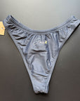 Our Midnight Bikini Bottom shown from the back, which comes in dark gray lying on a black background for more details.