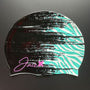 The ZEBRA - swim cap turns from midnight black in the front to a zebra style pattern in the color turquoise at the back.