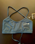 Ariel Bikini Top shown from the front lying on a black background for more detail.