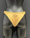 Back view of honey yellow bikini bottom by Jaze on mannequin, showing cheeky bum coverage, swimmer-approved design and long-lasting shape.