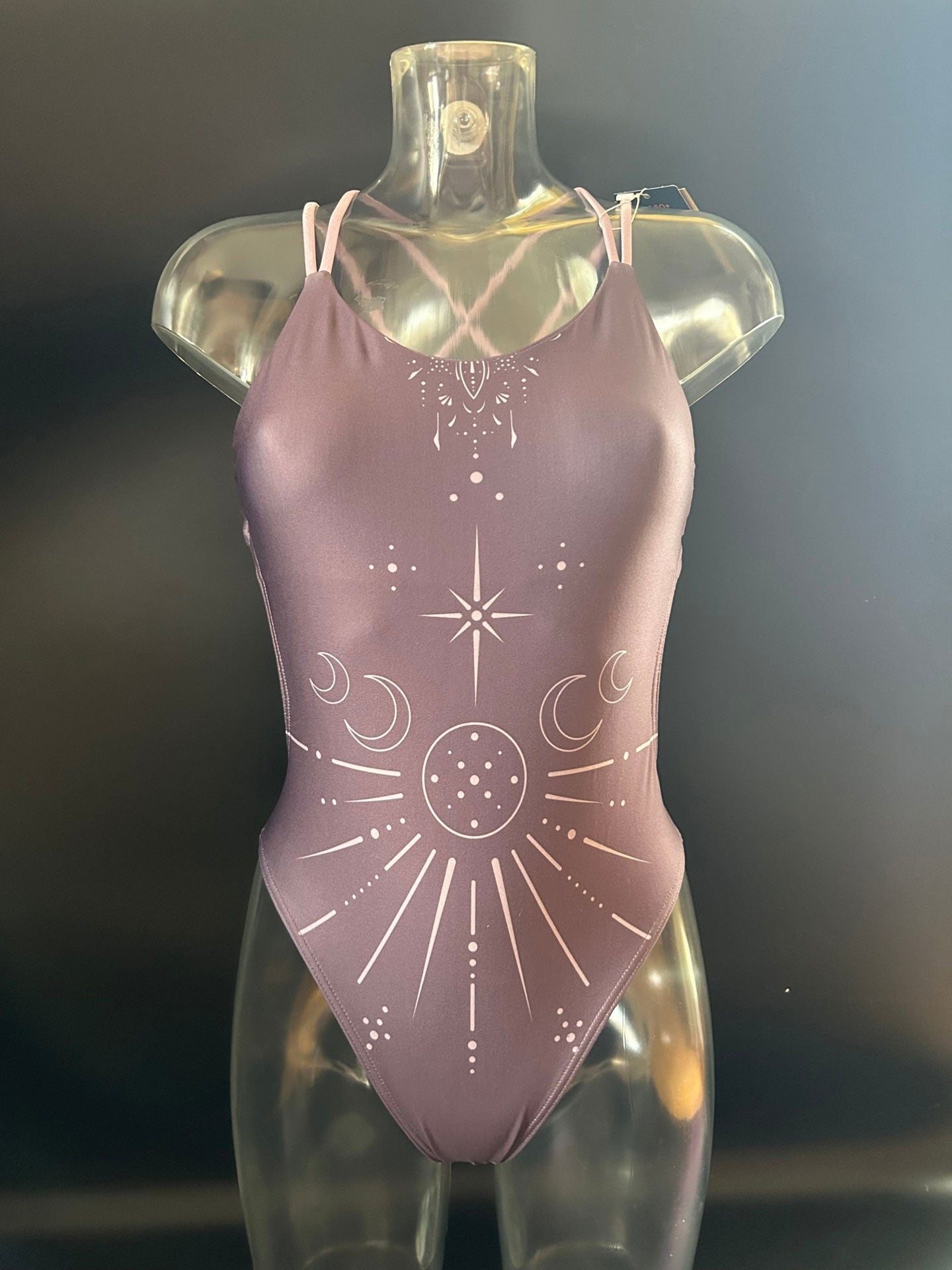 The Lila "Moonlight" one-piece swimsuit shown from the front on a mannequin for more details.