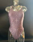 The Lila "Moonlight" one-piece swimsuit shown from the front on a mannequin for more details.