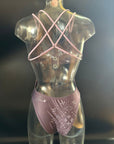 The Lila "Moonlight" one-piece swimsuit shown from the back on a mannequin, showing the open back and the adjustable straps.