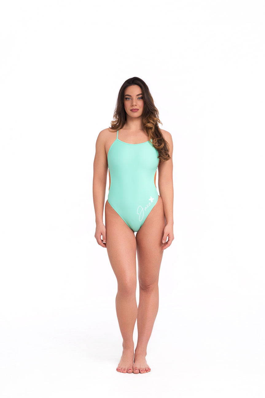 Model wearing jade one piece swimsuit in studio front pose with natural stance