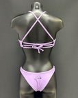 Back view of cheeky bikini bottom in color lavender by Jaze on mannequin, highlighting minimal coverage and premium sustainable fabric built for active training.