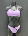 Front view of cheeky-cut bikini bottom in color lavender by jaze on mannequin, designed for performance with small bum coverage and adjustable inner drawstring.