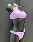 Side view of performance bikini bottom in color lavender by Jaze on mannequin, showing secure fit and soft eco-friendly Italian fabric for swimmers.