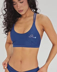 Model wearing blue Sea bikini bottom with high cut and clean minimal design