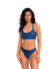 Model wearing blue Sea bikini bottom in full body front pose with matching top